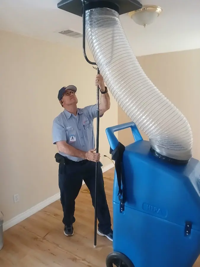 Furnace Tune-Up technician using HEPA equipment in Pebble Creek